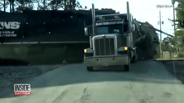 Driver Leaps to Safety as Train Crashes into Truck